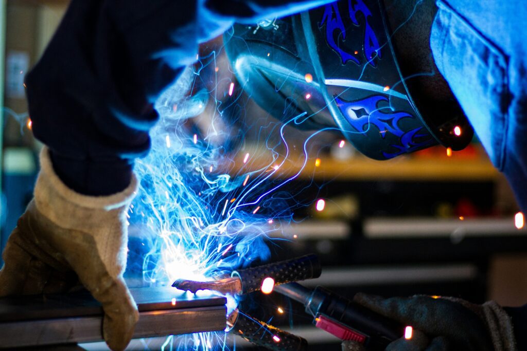 Welder working on a manufacturing line