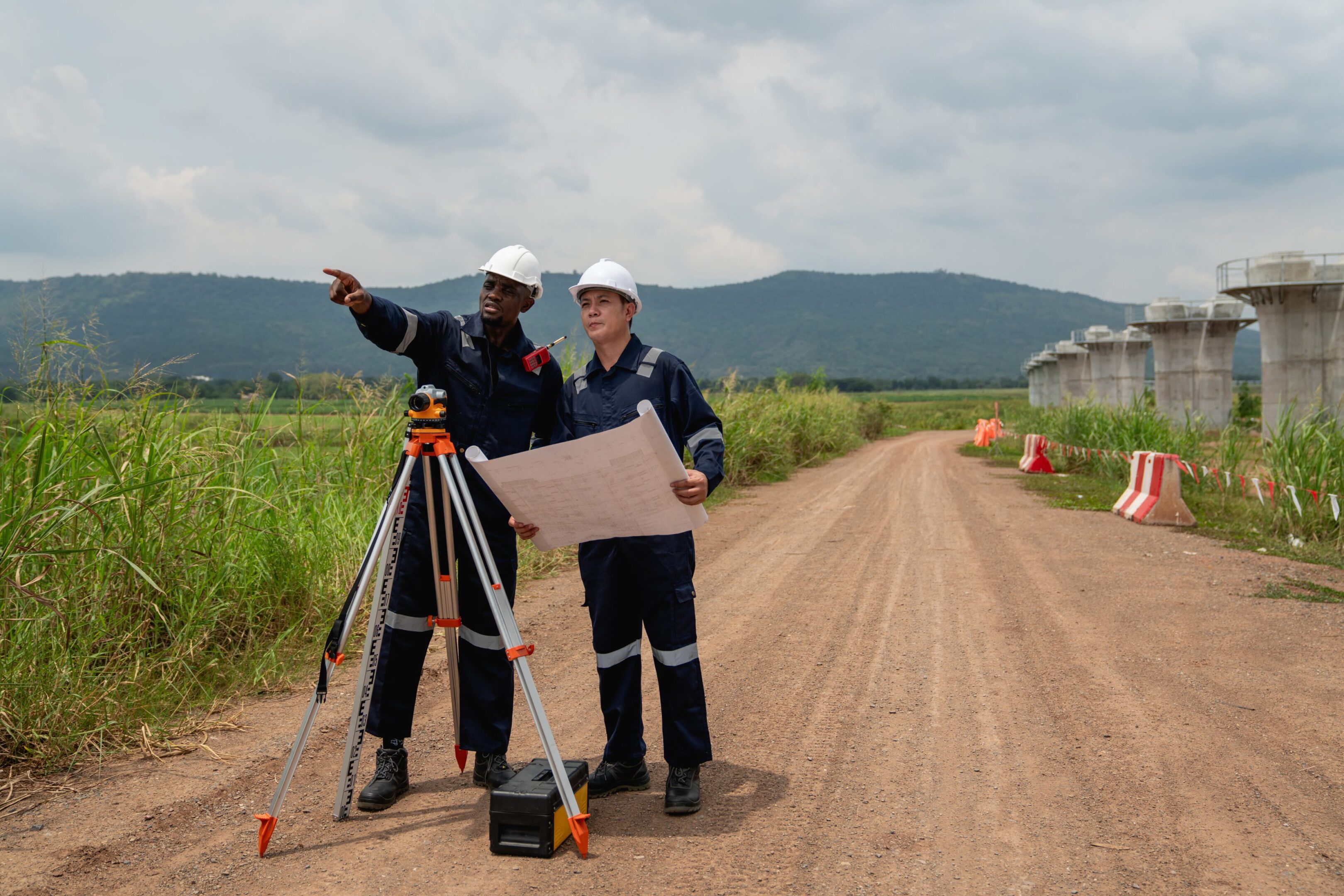 The,Survey,Team,Is,Using,A,Theodolite,And,Road,Construction