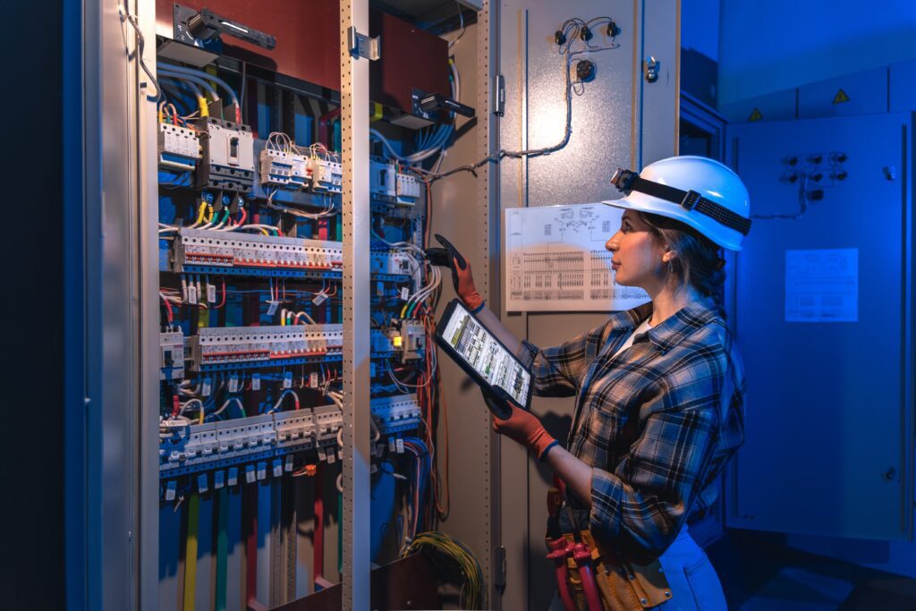 Electrician at a commercial panel